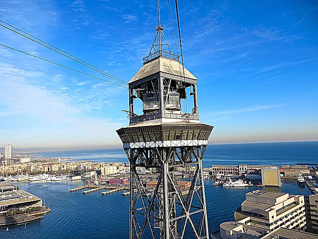 The top of the Jaume I tower of the Port Cable Car, with the harbour and sea behind